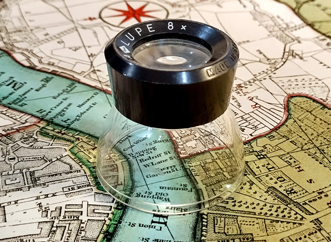 map print magnifying glass inspection